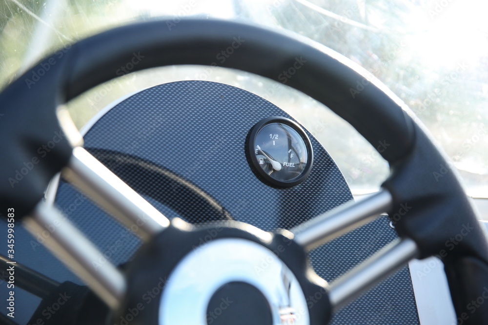 fuel level gauge on dashboard in a white motor boat close up fuel level gauge on dashboard in a white motor boat close up