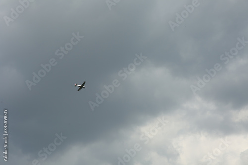 light aircraft in the sky with clouds