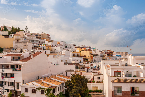Beautiful blue sky with clouds over the Costa Tropical town of La Herradura, Granada, Spain on a sunny, summer morning