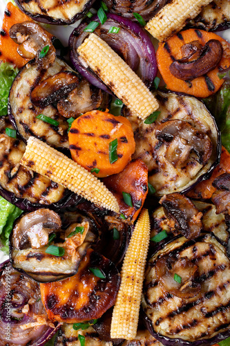 Grilled vegetables assortment. Mini corn, eggplant, sweet potato, red onion and champignon. Close-up. Top view