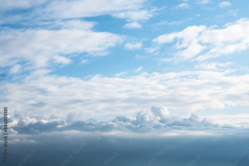 Sky. Blue sky with white and gray clouds. Perfect as wallpaper or background on your homepage or PC. Ideal as a banner, billboard, advertising banner, postcard and other.