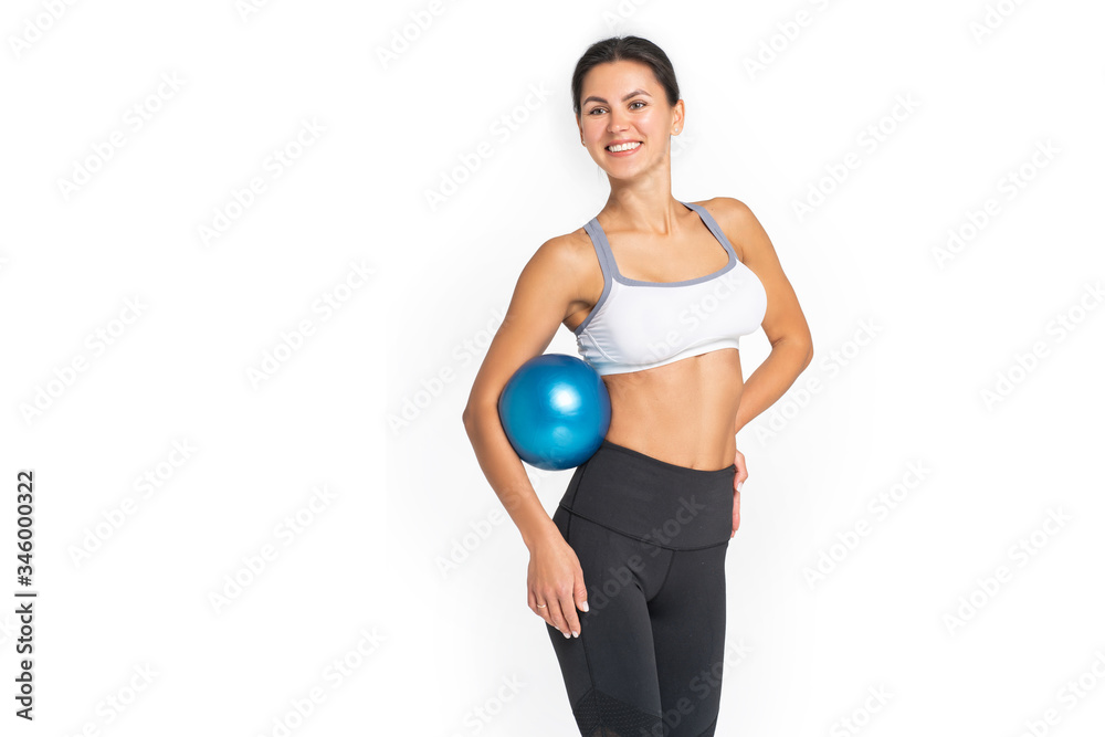 Beautiful sport woman doing stretching fitness exercise on ball.