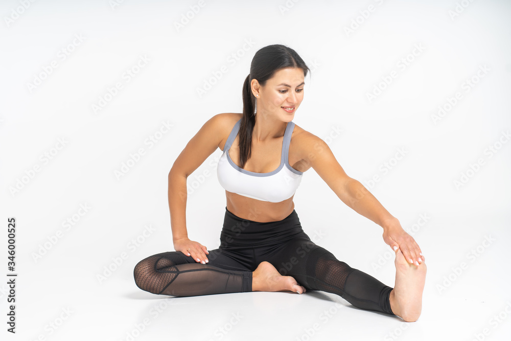 female trainer doing stretching before class female trainer doing stretching before class