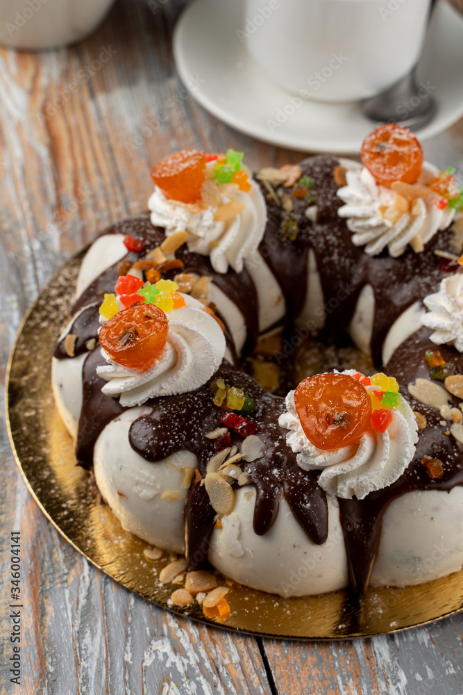 Orthodox easter cake with chocolate, raisins and nuts, decorated with chocolate icing and buttercream Orthodox easter cake with chocolate, raisins and nuts, decorated with chocolate icing and buttercream