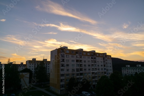 Sunrise and sunset  beautiful clouds over the meadow  hills and buildings in the town. Slovakia