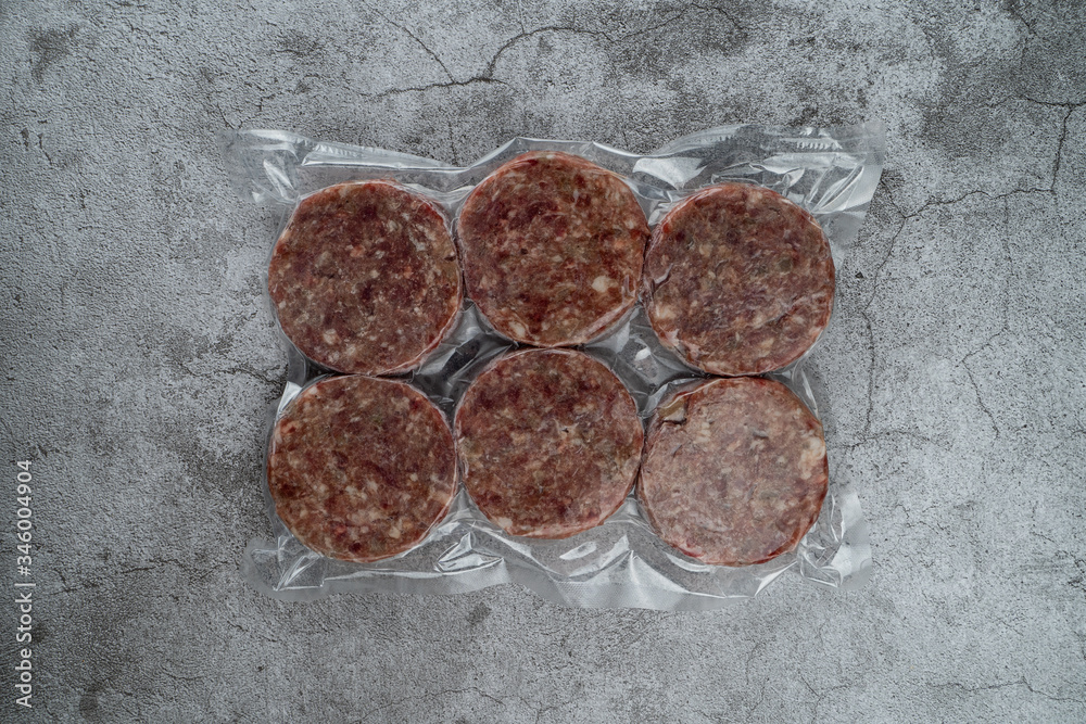 Blast chilled beef patties in a vacuum packing, ready-to-cook meat patties Blast chilled beef patties in a vacuum packing, ready-to-cook meat patties