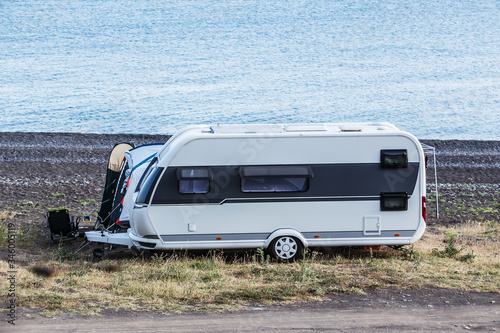 Camper trailer by the sea near the lagoon