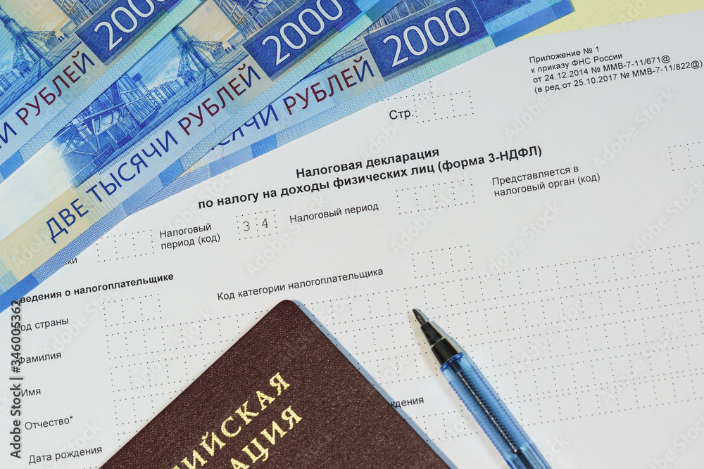 Obraz premium Declaration campaign based on the results of the year. the Tax Declaration on the tax to incomes of physical persons, a Russian passport, pen and money