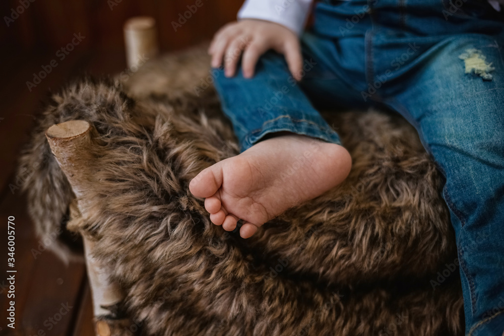Baby boy's foot close-up on the background of faux fur. Baby boy's foot close-up on the background of faux fur.