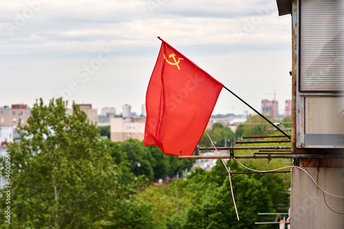 Soviet flag hung on an old residential building