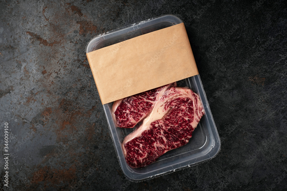 Raw beef Striploin steak in vacuum packaging, mockup for the logo design idea