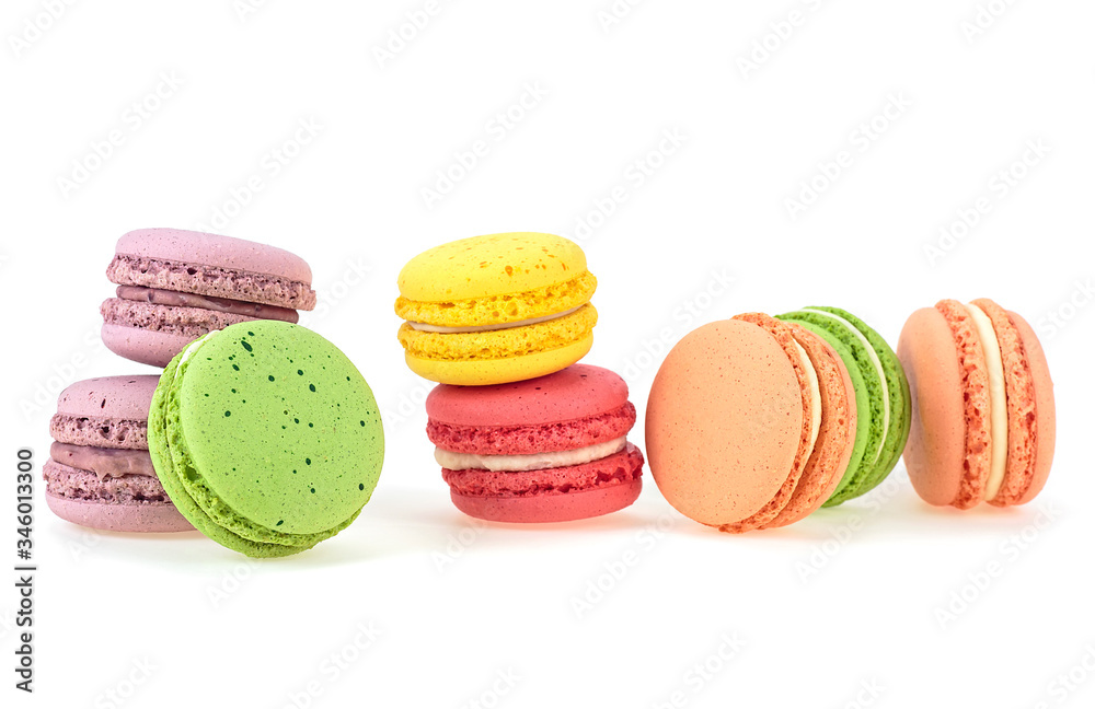 Colorful macaroons isolated on a white background. French sweet delicacy. Colorful macaroons isolated on a white background. French sweet delicacy.
