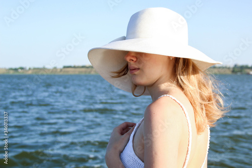young woman in white hat © Natalya
