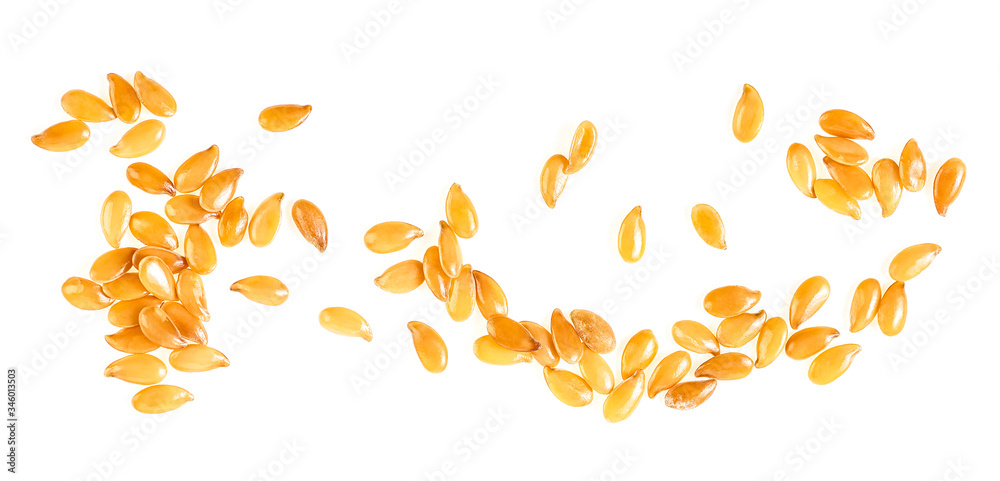 Linseeds - Yellow flax seeds isolated on a white background, top view. Linseeds - Yellow flax seeds isolated on a white background, top view.