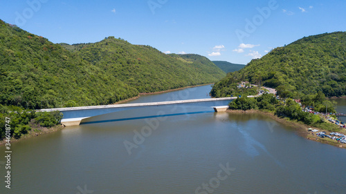Aerial view of the Pelotas River bridge with its green mountains. Border between Rio Grande do Sul and Santa Catarina, Brazil