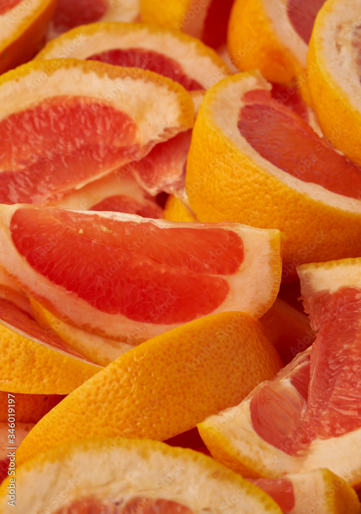 Grapefruit web banner background. Pile of fresh cut grapefruits. Fruits summer bright concept Grapefruit web banner background. Pile of fresh cut grapefruits. Fruits summer bright concept