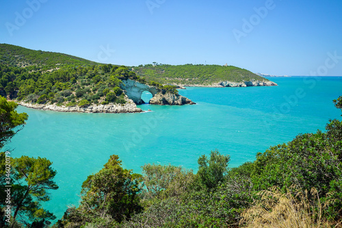 Vieste  San Felice arch rock bay  Gargano peninsula  Apulia  southern Italy  Europe. panoramic view of San Felice Bay with Architello  little arch  of San Felice.  Gargano National Park  Italy.