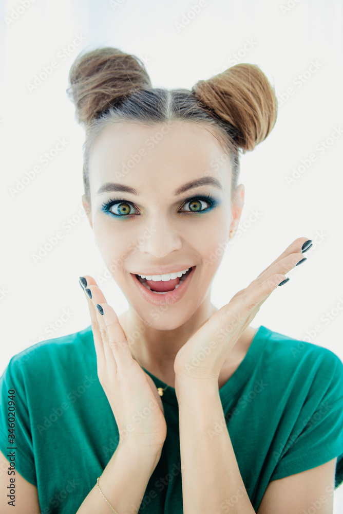 Beautiful young girl with beautiful makeup in a green t-shirt Beautiful young girl with beautiful makeup in a green t-shirt