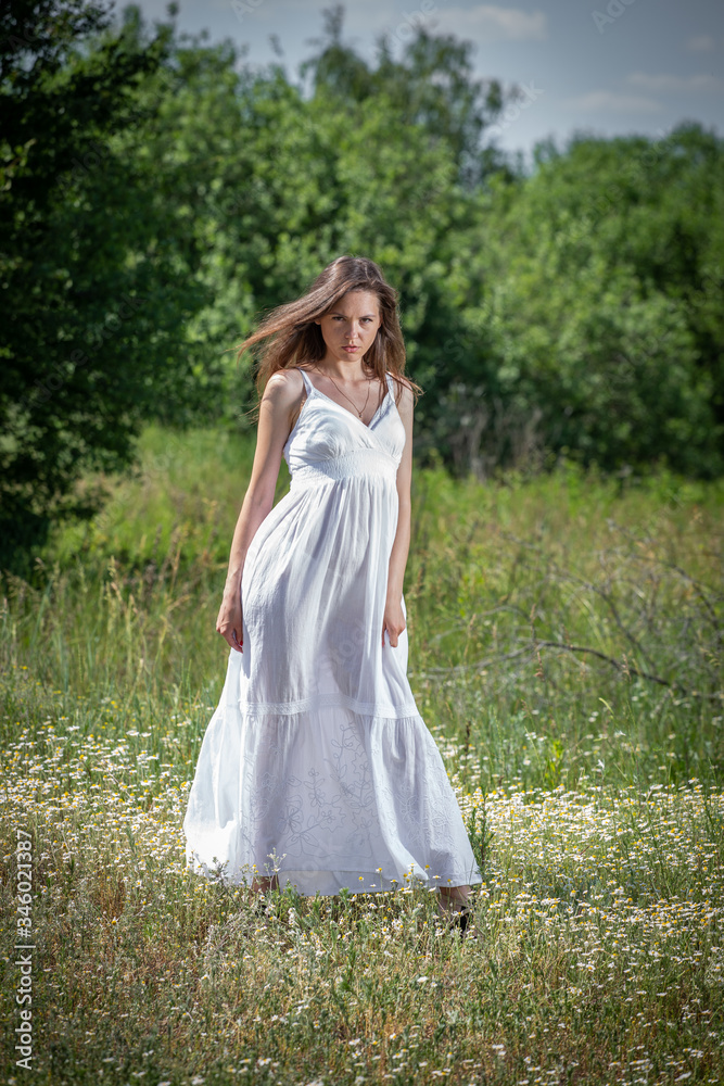 Young woman in white dress