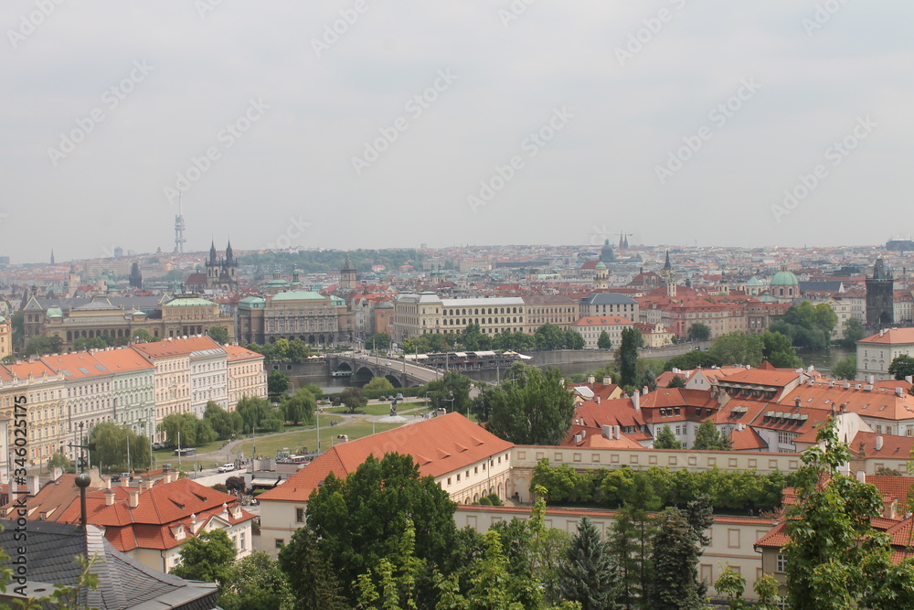 urban landscape top view red roofs of houses and visible square and castle Prague Czech Republic