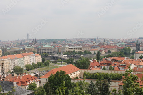 urban landscape top view red roofs of houses and visible square and castle Prague Czech Republic © Кристина Шоба