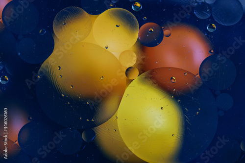 Abstract yellow red circles effect on the black background. Abstract colorful texture.