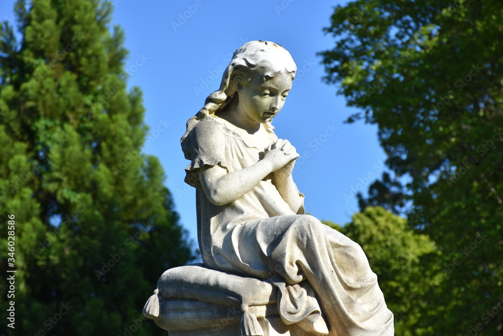 Small statue in a cemetery 