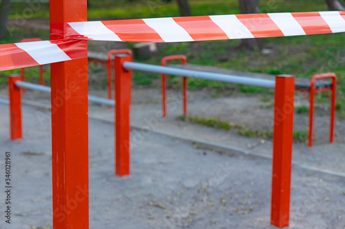 limited ban tape red and white color around sport playground area outside space unfocused background space