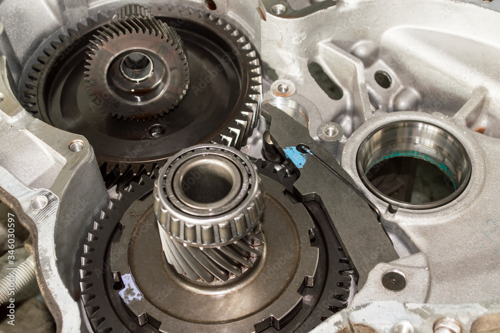 Disassembled gearbox housing cover with fifth gear gears inside Disassembled gearbox housing cover with fifth gear gears inside