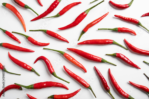 Red hot little chili peppers pattern on white background.