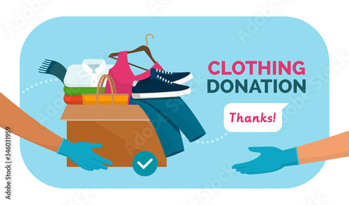Fényképezés Volunteer giving clothing donation box