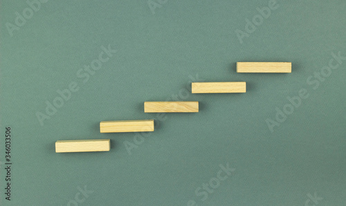 Five wooden blocks in the form of steps, an alternative plan for the concept of risk and a strategy in business, risk making a business growth concept with wooden blocks.