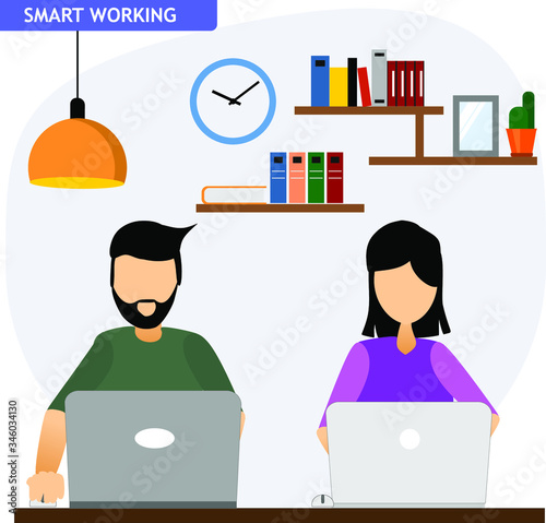 a man and woman work with their laptop from home in smartorking mode photo