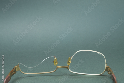 Broken reading glasses. eyeglasses without one lens