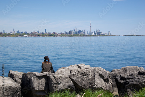 single sitting on the rock overlook the cityscape of Toronto, Canada