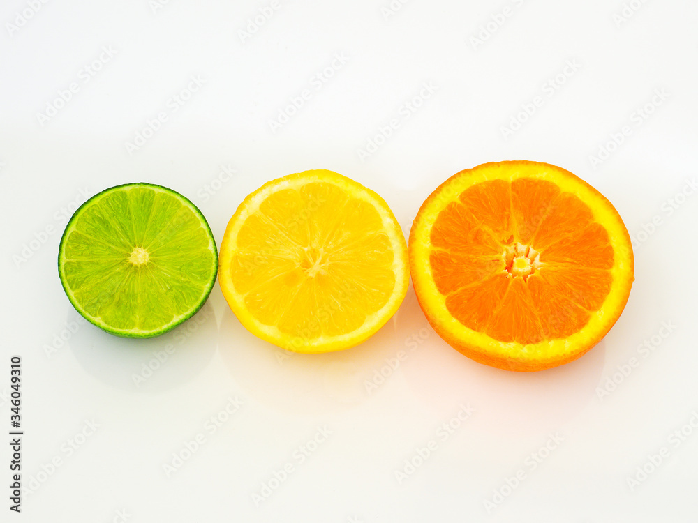 sliced limes lemons and oranges on white background sliced limes lemons and oranges on white background