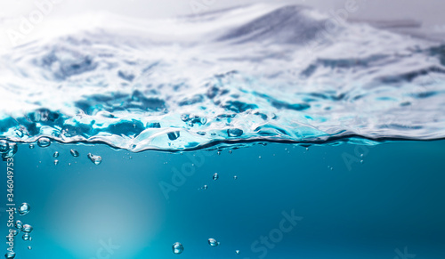 The deep blue ocean surface that can be seen from underwater. Abstract waves underwater blur.