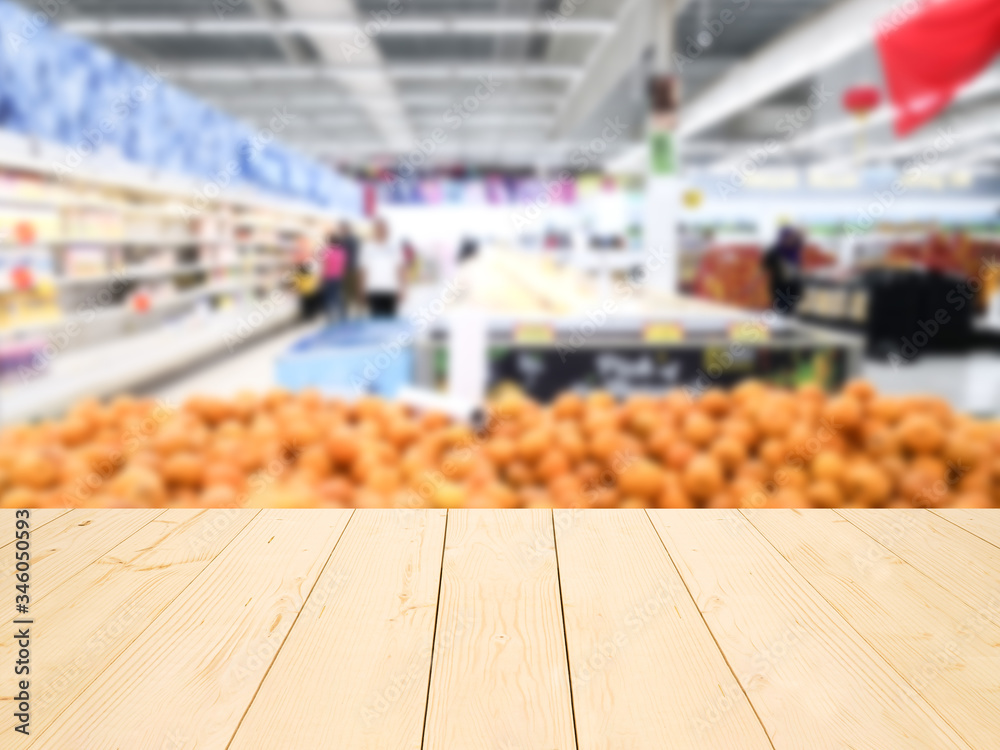 wooden table or wooden mock up over blurred supermarket background wooden table or wooden mock up over blurred supermarket background