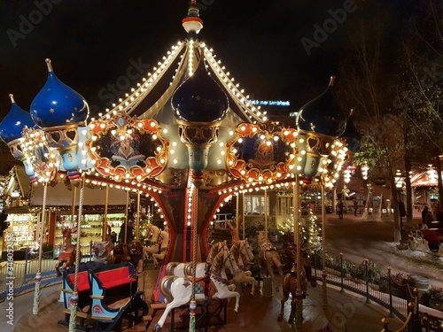 Amusement park at night with lights - Carousel close up shot - Merry go round