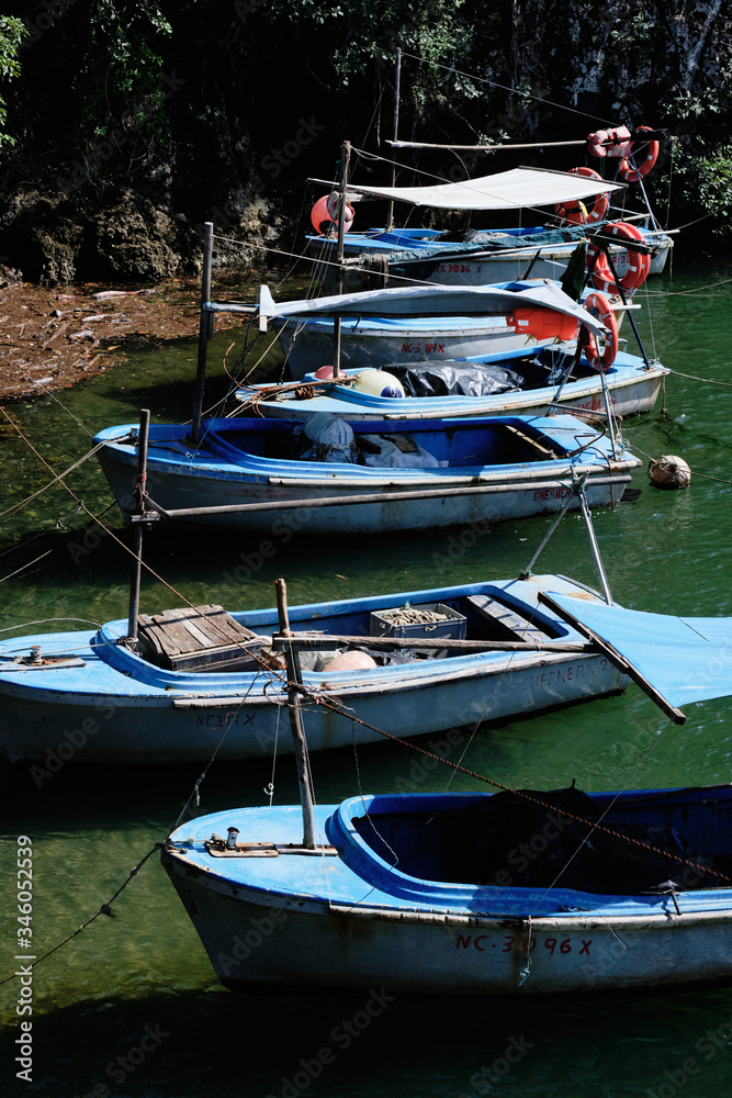 High angle small blue fishing boats in Baracoa, Cuba High angle small blue fishing boats in Baracoa, Cuba