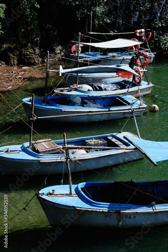 High angle small blue fishing boats in Baracoa, Cuba