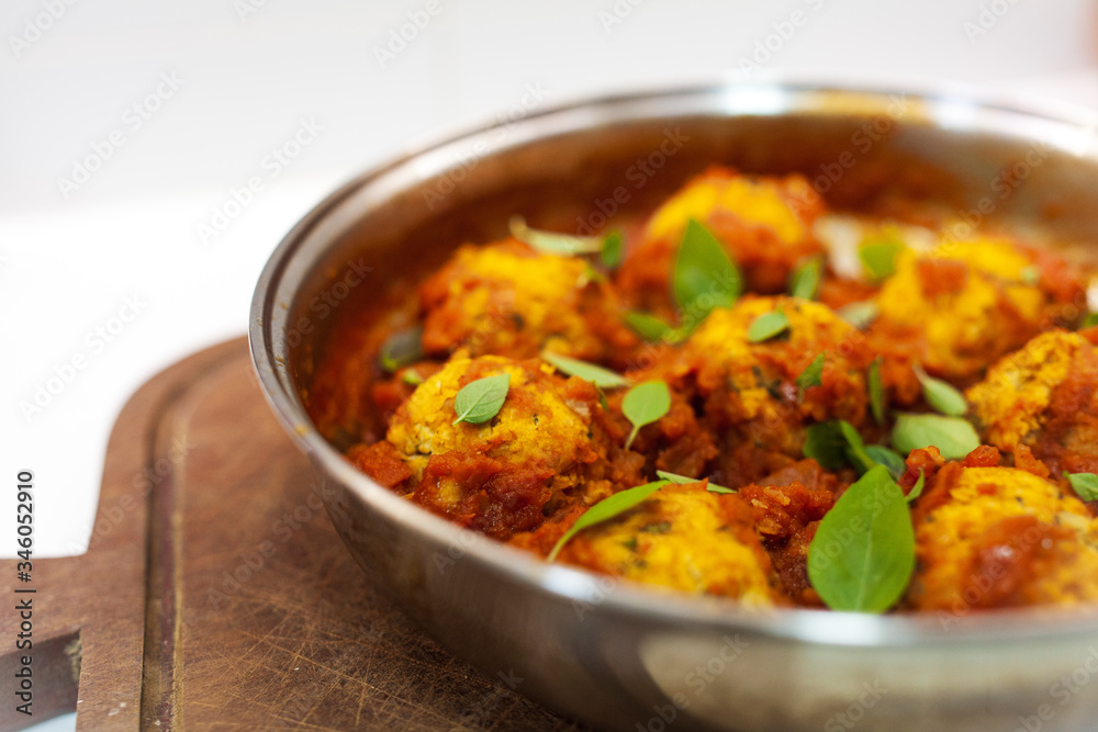 a delicious homemade recipe of vegetarian rissole in tomato sauce and basil