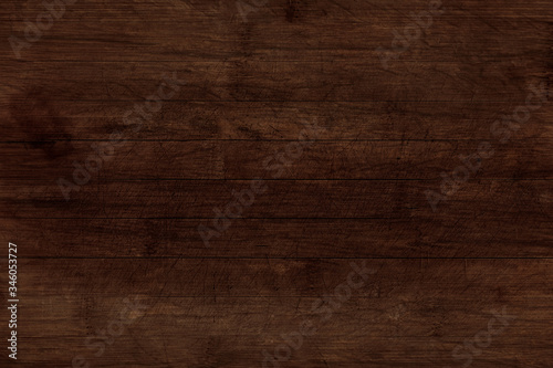High resolution old wooden texture and background. Brown old oak wood table surface with knots and scratches. Dark wooden background for serving food.