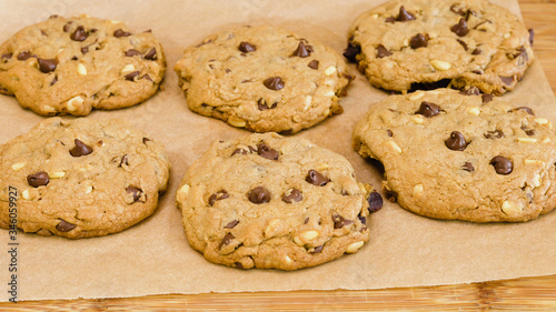 Chocolate Chip Cookies with pine nuts close up on wooden background. Homemade old-fashioned Chocolate Chip Cookies. American cuisine, dessert