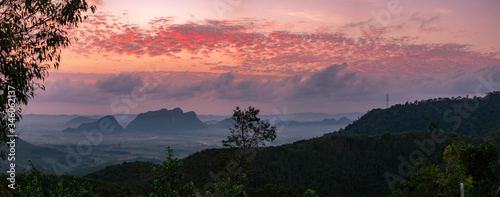 Scenery of mountains under mist in the morning in Thailand. photo