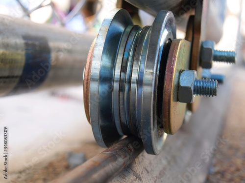 Obraz na plátně Closeup-Sliding door wheel with wheel bearing For manual opening and closing Sel
