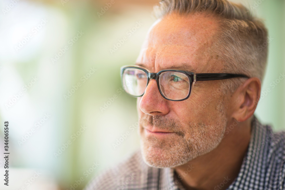 Mature handome fit man sitting outside stock photo Mature handome fit man sitting outside stock photo