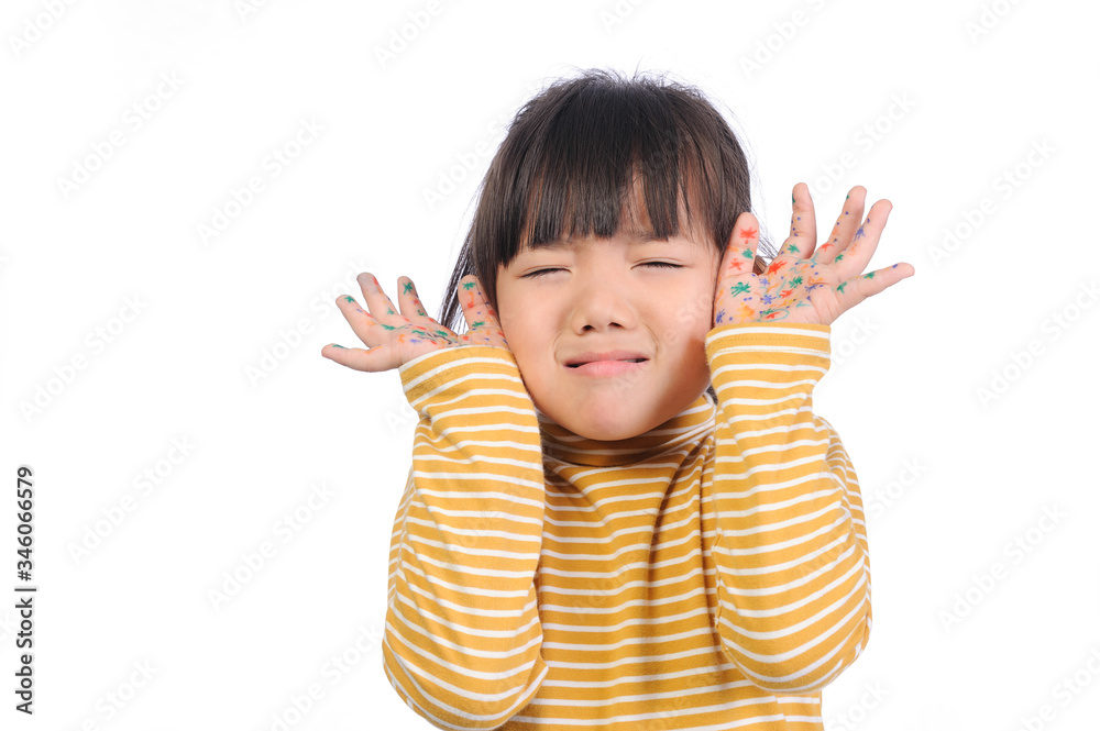 Baby health care for germs and touch concepts. A little Asian girl (5years old) shocking by bacteria on hands. Kid in yellow t-shirt with emotion face and The gestures raised both hands near face. Baby health care for germs and touch concepts. A little Asian girl (5years old) shocking by bacteria on hands. Kid in yellow t-shirt with emotion face and The gestures raised both hands near face.