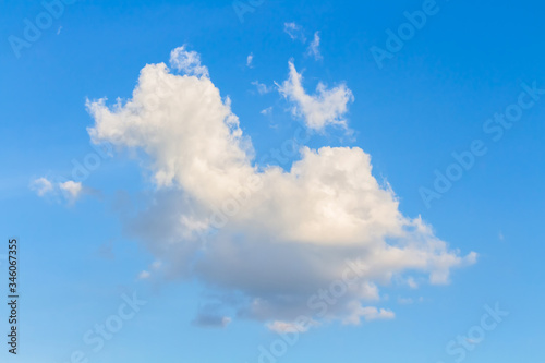 Fluffy white clouds on color blue sky