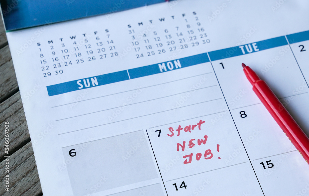 Start new job words written on table calendar with red marker Start new job words written on table calendar with red marker